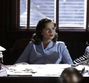 Agent Carter sits at a desk