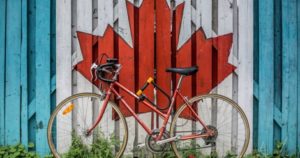 bike leaning against Canadian leaf
