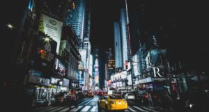 image of Times Square in New York City at night https://unsplash.com/photos/fLxWR2dS76I