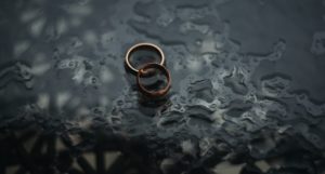 wedding rings on wet surface