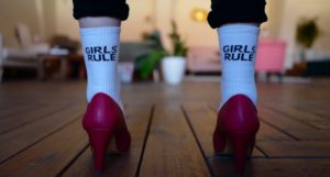 image of woman's legs wearing pink pumps and socks that read "Girls Rule" https://unsplash.com/photos/lvtGsnaZzt4