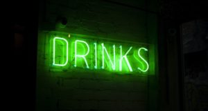 image of a neon green sign that reads "Drinks: https://unsplash.com/photos/LbUzPqxPUAs
