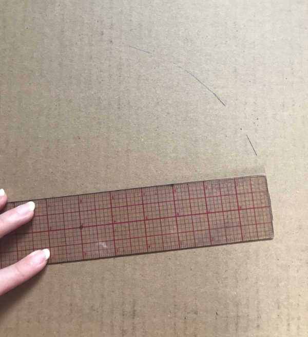 Drawing dashes on cardboard with a ruler