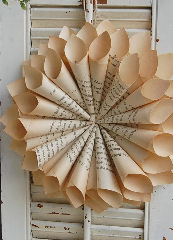 Picture of book page wreath against vintage window shades
