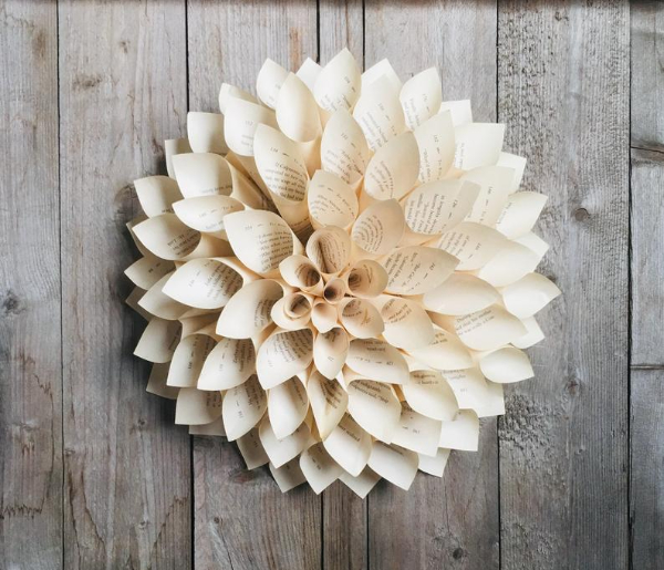 Dahlia book page wreath against wooden floorboards