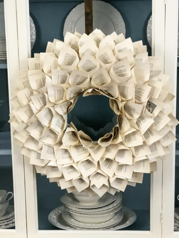 Picture of vintage book page wreath against china cabinet