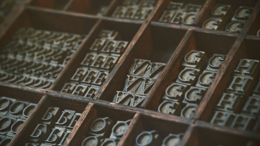 image of assorted letter tiles in a wooden organizer box https://unsplash.com/photos/Oxl_KBNqxGA
