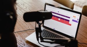 a microphone positioned in front of a laptop computer https://unsplash.com/photos/h6PDEdr9IZo