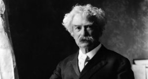 black and white photograph of Mark Twain https://commons.wikimedia.org/wiki/Category:Photographs_of_Mark_Twain#/media/File:Mark_Twain_by_Ernest_H_Mills,_c1895.jpg