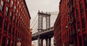 Brooklyn New York view of the bridge between two brownstone buildings