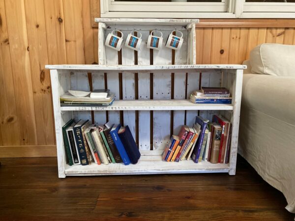 White reclaimed wood bookcase with hooks for mugs