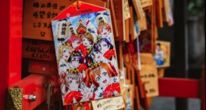 image of anime characters on a shrine in Japan