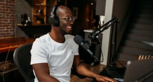Image of a Black man podcasting