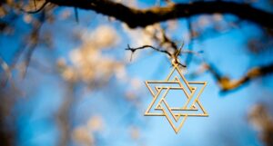 star of david hanging from tree branch