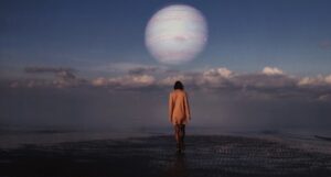 surreal image of young woman walking across water towards a planet in the distance