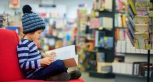 image of a child reading inside a bookstore