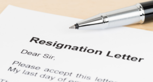 a photo of a resignation letter and a pen