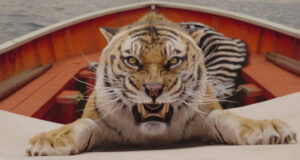 a still from a movie showing a tiger growling