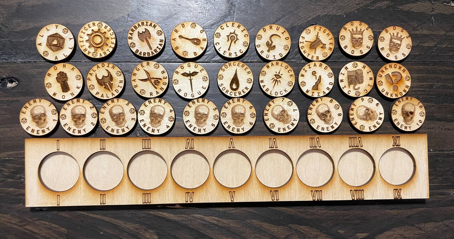 A photo of a wooden Initiative Tracker Board with circle cavities that are labeled with Roman numerals one through nine. Several round wooden pieces show the race of a player character and a symbol to represent that race. 