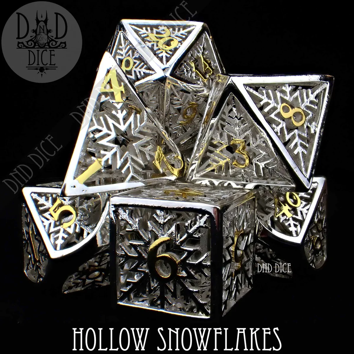A photo of a set of six silver and gold Hollow Metal Dice with Snowflakes on the faces. The photo has two labels that read DND Dice and Hollow Snowflakes.