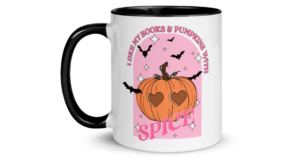 a mug with a pumpkin on it that reads "I like my books and pumpkins with spice"