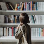 a photo of someone browsing bookshelves