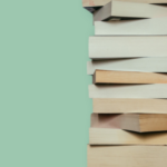 a photo of a stack of paperback books again a green background