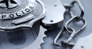 a photo of a police badger with handcuffs