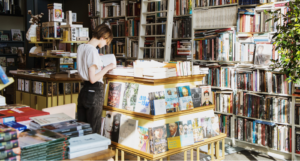 a photo of a person browsing a bookstore