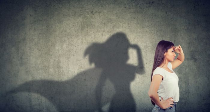 image of a person with a superhero shadow behind them