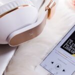 headphones and an iphone playing audible