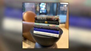 A stack of books - Reckless by Lauren Roberts, The West Wind by Alexandria Warwick, The Last Dragon of the East by Katrina Kwan, The Serpent and the Wolf by Rebecca Robinson, Vilest Things by Chloe Gong, and Spark of the Everflame by Penn Cole