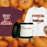 selection of pumpkin-spice themed bookish gifts, including stickers, apparel, and a candle