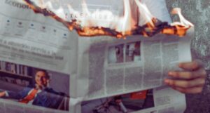 newspaper on fire