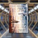 the space between worlds book cover against blurred backdrop of spaceship hallway