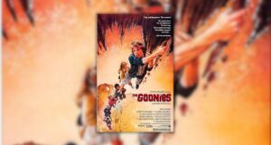 poster for the movie The Goonies showing the kids from the movie holding onto a rope