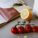 cooking ingredients near a cookbook on a counter