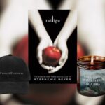 book cover of Twilight by Stephanie Meyer in the middle of four Twilight-themed gifts: a book sleeve, a baseball cap, a candle, and a bag of loose leaf tea