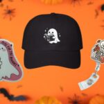 three spooky-themed gifts for readers: a ghost sticker, a cap with an embroidered ghost reading design, and a skeleton reading badge reel