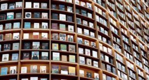 a curved wall of books at a bookstore