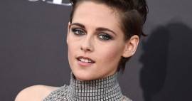 Kristen Stewart in a metallic mesh turtleneck w/ a helmet-style hairdo