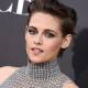 Kristen Stewart in a metallic mesh turtleneck w/ a helmet-style hairdo