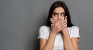 a photo of a woman covering her mouth