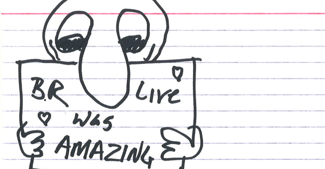 sketch of a person holding a sign that says "BR Live was AMAZING" with little hearts in the corners