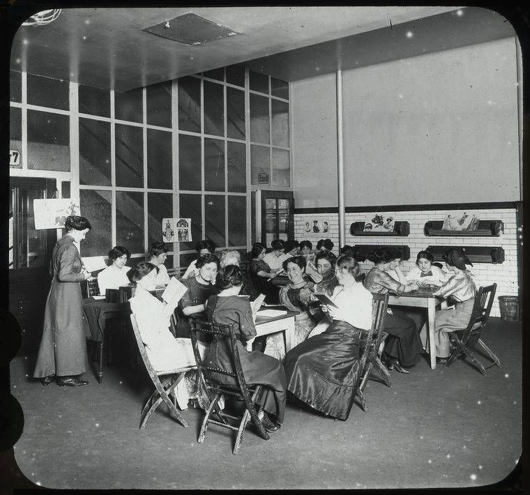 Young women around tables reading, P.S. 63, Recreation Center, May 1911 - Lewis Wickes Hine