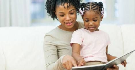 Mom reading to daughter