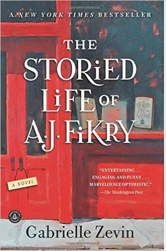 cover image of The Storied Life of A.J. Fikry by Gabrielle Zevin, illustration of the front of a bookstore, painted red, with a big display window and a door