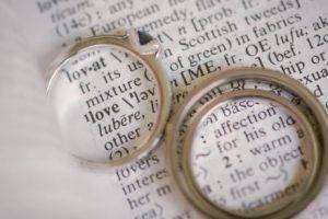 My engagement ring with the open book setting, and our matching wedding rings.