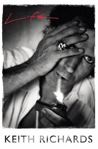 cover of Life by Keith Richards; black and white photo of the author, with one hand covering his face and wearing a skull ring