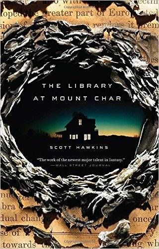 cover of The Library at Mount Char by Scott Hawkins; image of a house at night in the middle of a hole ripped in a book